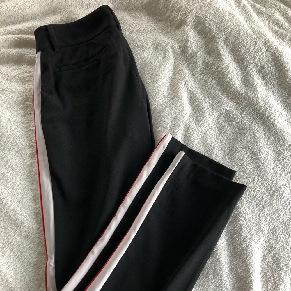 Black trousers with white and red stripe.